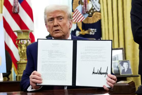President Trump is wearing a dark suit, sitting in the Oval Office holding up an open document with a bold signature. The American flag and presidential seal are visible in the background." Let me know if you'd like any adjustments!