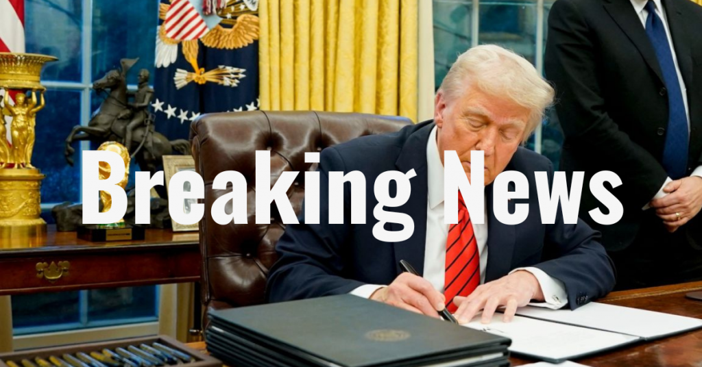 The image shows president Trump sitting at a desk in an official setting, signing a document. The desk has various items on it, and there is a background with American flags and an ornate setting. Overlayed on the image is the text "Breaking News" in bold white letters.