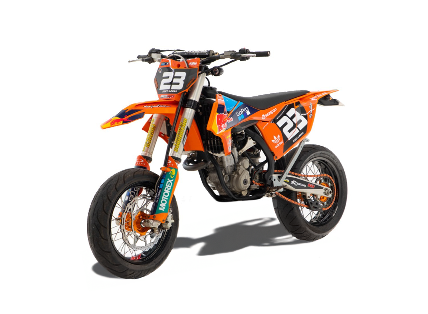 This image shows an orange KTM dirt bike with racing graphics and the number 23 displayed on the front and sides designed for off-road and motocross performance.
