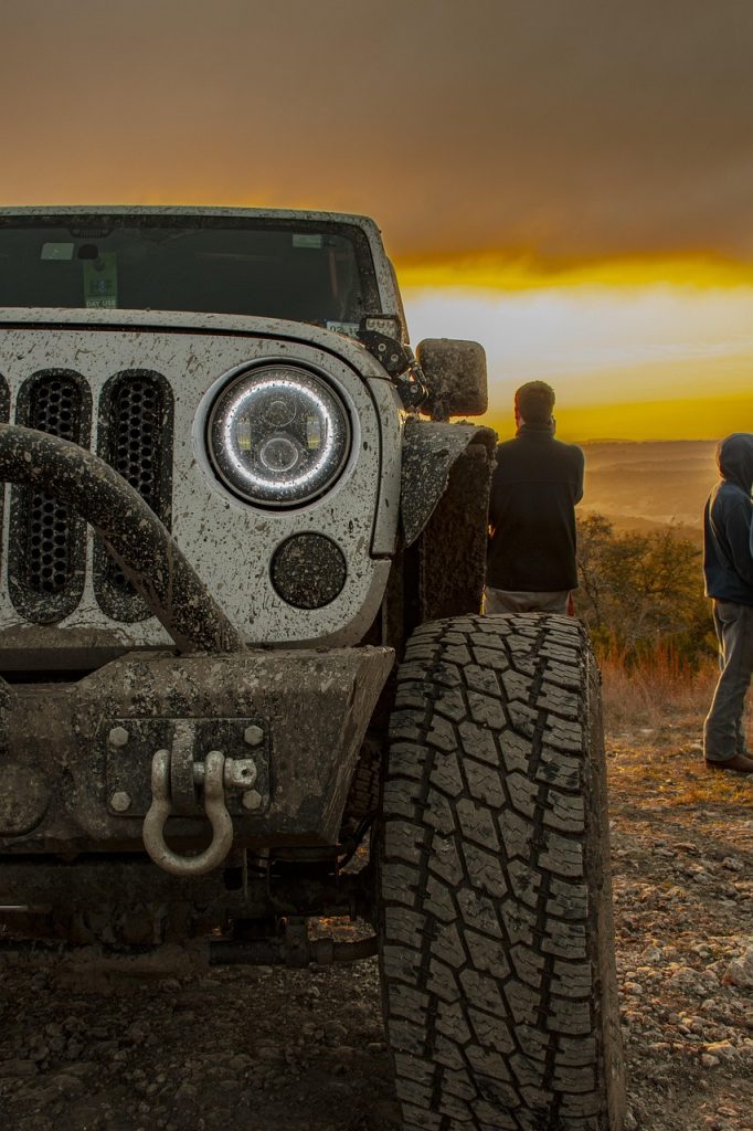 A rugged 4x4 overlooks the horizon at sunset, proving that epic adventures start with the right off-road vehicle registration to keep every journey legal and hassle-free.