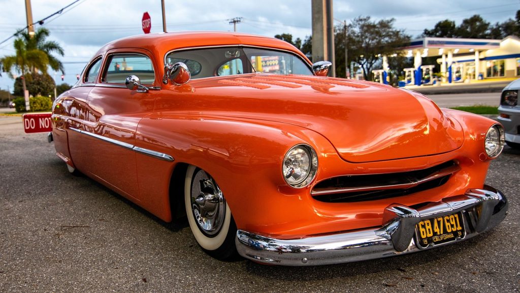 This bright orange classic Mercury custom can be made road legal without a title by using a bonded title or Montana LLC registration to obtain plates and insurance.