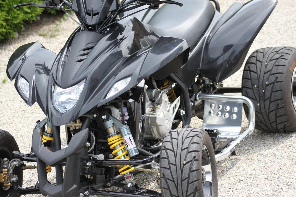 Sleek quad registered for road use with black bodywork and sport suspension.