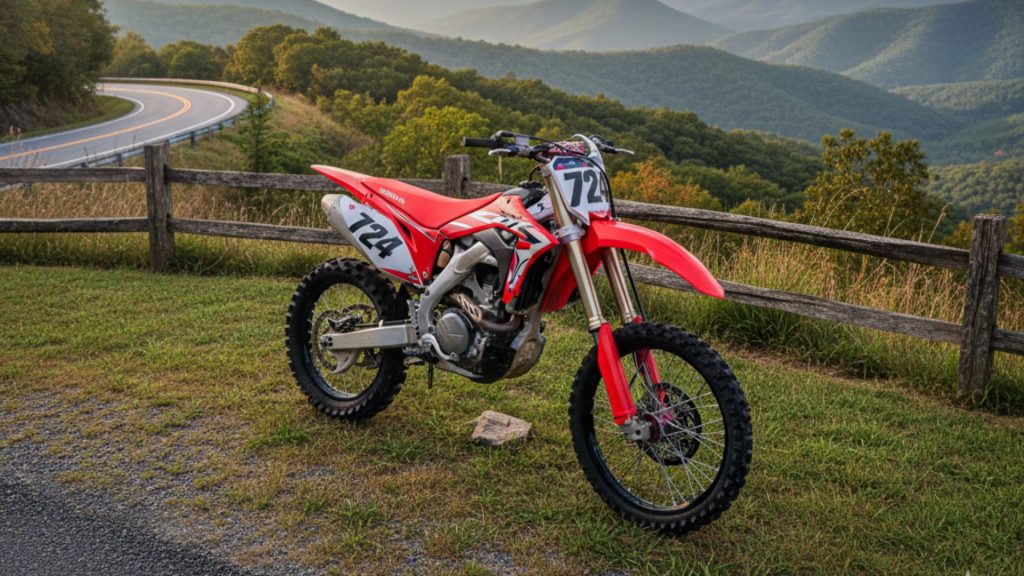 dirt bike parked on a grassy overlook along the scenic Blue Ridge Parkway in Virginia, with rolling mountains and lush forests stretching into the distance.